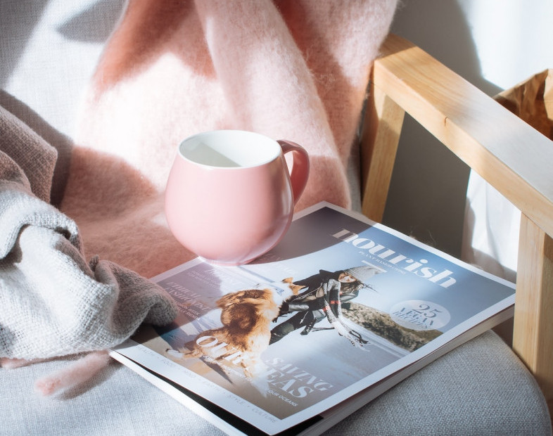 Self Care Night Routine - picture of blankets, tea and magazines