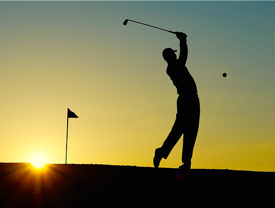 The science behind law of attraction - a man is playing golf