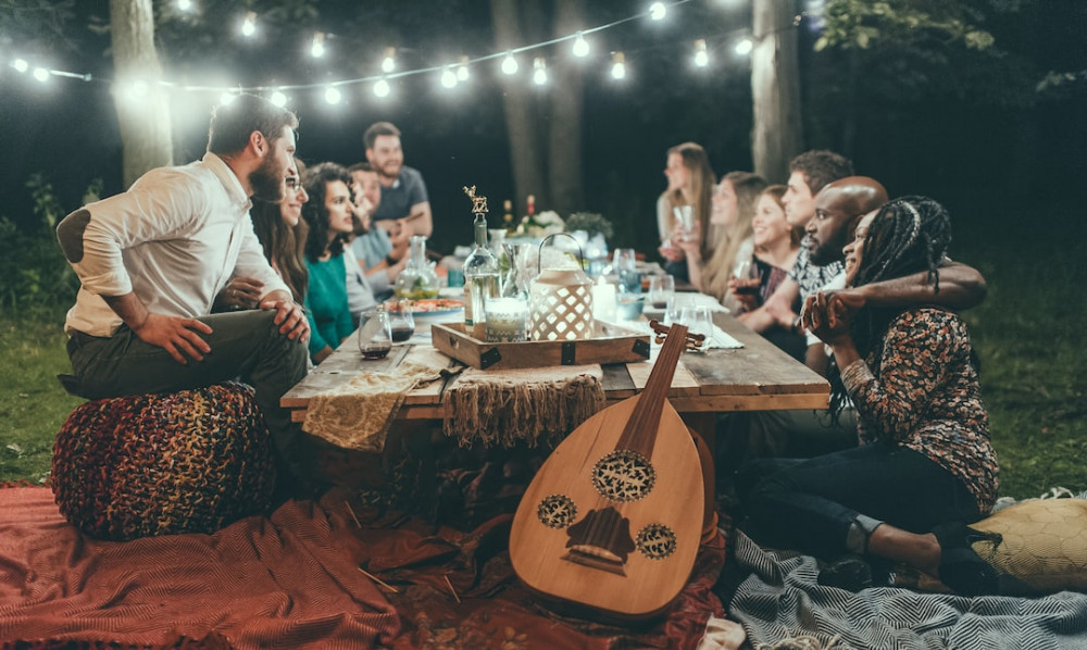 Gratitude Games for Adults: a group of friends is enjoying dinner together