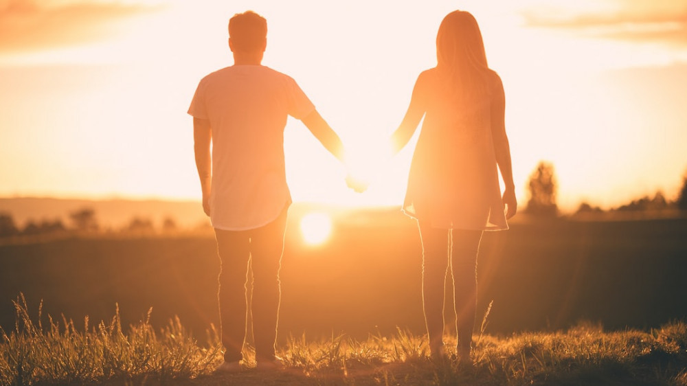 Finding Love Affirmations: a couple is holding hands