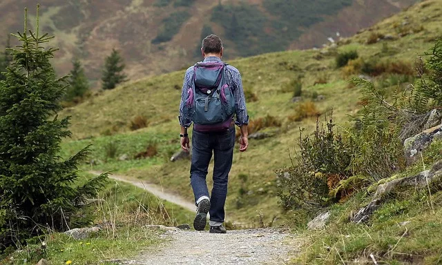 summer bucket list ideas: a man is hiking