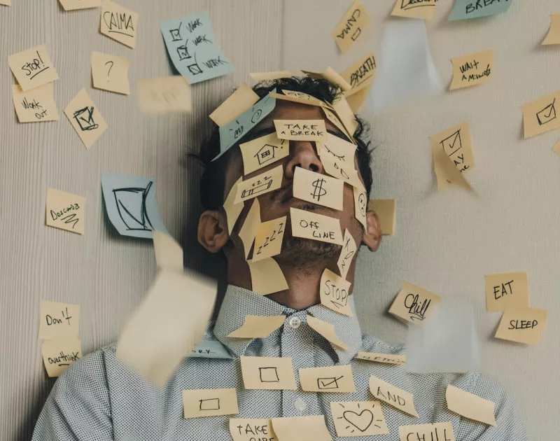 The Law of Attraction for money and wealth: a man is full with sticky notes