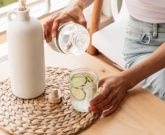 How to lose stomach fat in 3 days: a woman is drinking water