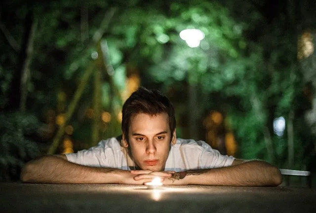 How to increase psychic abilities: a man is staring at a candle