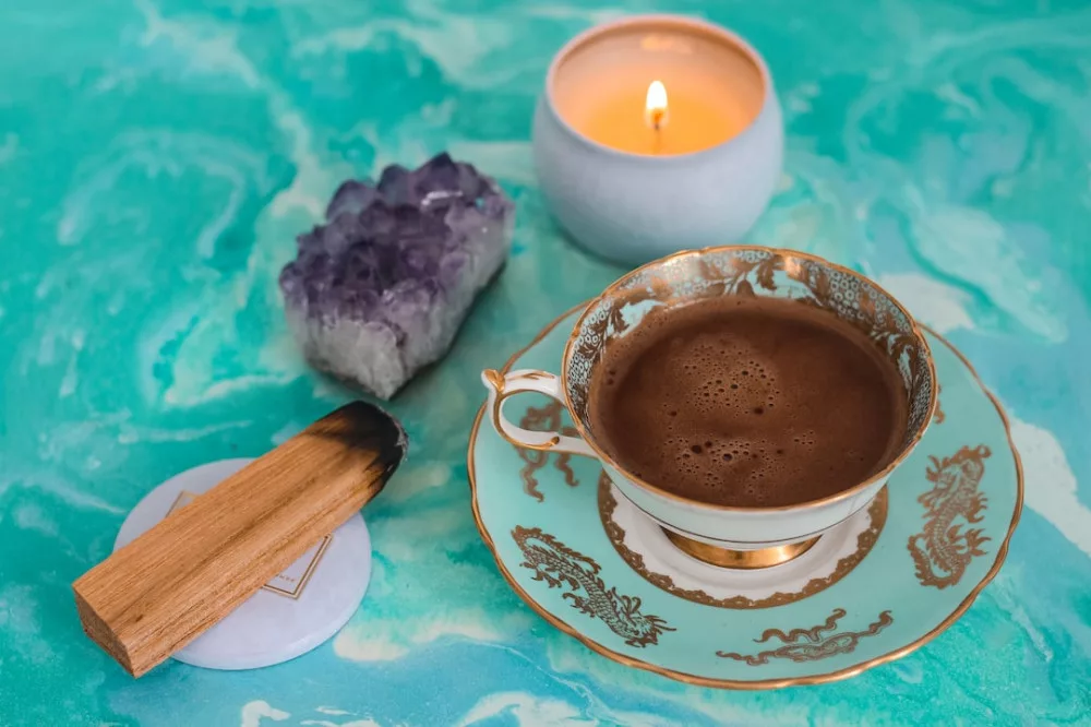 How to read tarot cards for beginners:  a cacao cup, sage and crystals