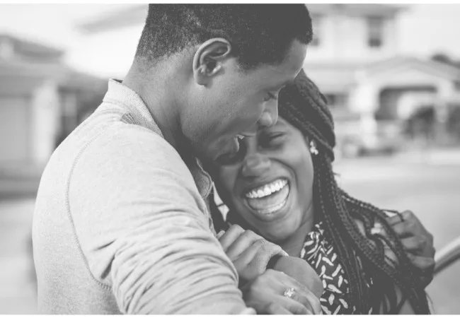 when you feel you’re not good enough: a couple is laughing happily